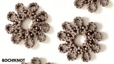 three pieces of beaded fabric are arranged in the shape of snowflakes