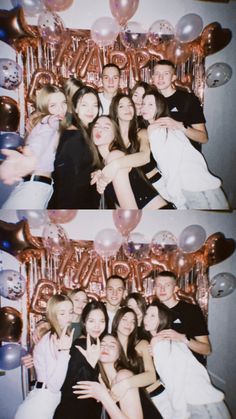 a group of people standing next to each other in front of balloons