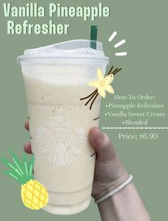 a hand holding up a starbucks drink with pineapple on the top and vanilla in the bottom