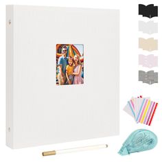 a white photo album with two photos on the front and one in the middle next to it