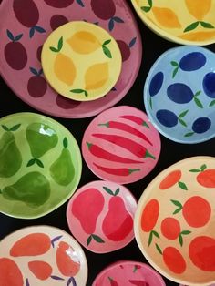 many colorful plates with different designs on them