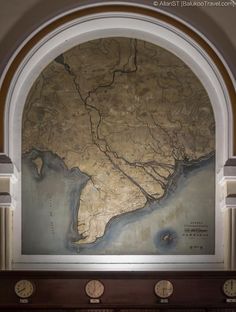 an arch with a map on the wall