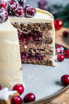 a slice of cake with cranberries on top