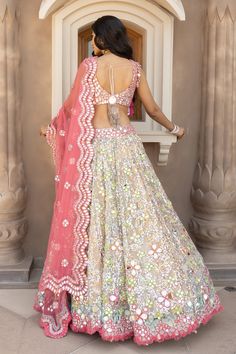 Multicolor attached can-can lehenga with mirror, sequin and zari embroidery. Paired with mirror and zari work, padded blouse and scallop pink dupatta.
Components: 3
Pattern: Embroidered
Type Of Work: Sequin, Zari, Mirror
Neckline: Scoop
Sleeve Type: Sleeveless
Fabric: Net
Color: Multi Color
Other Details: 
Scallop dupatta
Tassel hem blouse
Back tie-up tassel
Lehenga Length approx.: 41-42 inches
Note: Only the product mentioned in the description and images is being sold 
Occasion: Bride,Destinat Day Concert Outfit, Green Day Concert, Haldi Outfit For Bride, Lehenga Banarasi, Bride Haldi, Scallop Dupatta, Outfits For Bride, Mirror Sequin, Abhinav Mishra