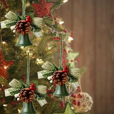 a christmas tree decorated with bells and pine cones