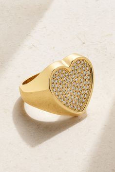 Established's statement-making jewelry is edgy, yet elevated. This heart-shaped ring is handcrafted from 18-karat gold and inlaid with sparkling diamonds. Luxury Heirloom Yellow Gold Heart Ring, Luxury Heart Cut Ring With Polished Finish, Gift Heart Ring With Single Cut Diamonds, Gold Heart Shaped Ring With Single Cut Diamonds, Heart Shaped Diamond Ring For Gift, Heart Shaped Diamond Ring As Gift, Heart Shaped Gold Ring With Single Cut Diamonds, Luxury Heart Ring With Vs Clarity For Promise, Luxury Vs Clarity Heart Promise Ring