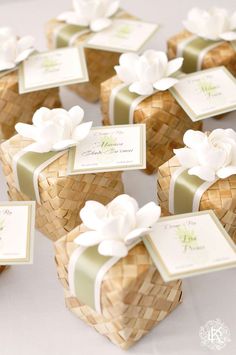 small gift boxes with white flowers on them