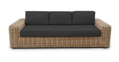 an outdoor wicker sofa with black cushions