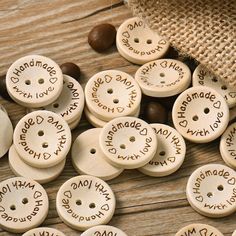 wooden buttons with words written on them sitting next to some nuts and burlock