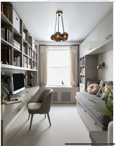 a living room filled with lots of furniture and bookshelves next to a window