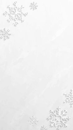 snowflakes on a white paper background with space for text or image in the center