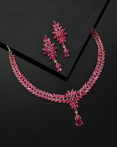 * CZ zirconia necklace and a pair of earrings * Pink gold-plated American diamond studded leaf shaped necklace, has a hook closure * A pair of matching drop earrings, secured with post and back closure *Size:- Length of necklace: 41 cm Length of earrings: 4.5 cm *Material:- Material: Brass Plating: Gold-Plated Stone Type: CZ, Zircon American Diamonds NOTE All the raw material used in this product is of high quality and is handcrafted with love. Premium Quality and High craftsmanship 100% Satisfa Ruby Pendant Indian, Ruby Necklace Indian Gold, Ruby Necklace Indian, Ruby Gold Necklace, Ruby Necklace Gold, Ruby Choker, Emerald Diamond Necklace, Gold Ruby Necklace, Ruby Jewelry Necklaces