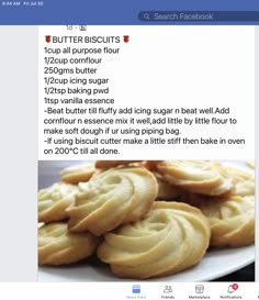 a white plate topped with cookies on top of a table next to a facebook page