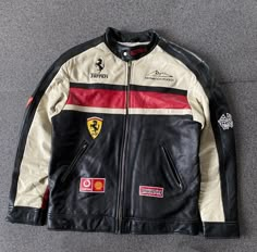 Immerse yourself in the legacy of speed and style with the Black and White Ferrari Leather Racing Jacket. Crafted from Genuine Cowhide, this iconic piece boasts an array of features that blend heritage with contemporary flair: Material: Genuine Cowhide leather, ensuring unparalleled quality and durability. Design: Classic racing jacket silhouette with a modern twist, exuding vintage Ferrari charm. Closure: Full YKK Zip closure, providing both functionality and a sleek aesthetic. Embellishments: Ferrari Leather Jacket, Racing Leather Jacket, Leather Racing Jacket, Ferrari Jacket, Motorbike Jackets, Ferrari Racing, Racing Jacket, Motorcycle Leather, Ferrari Logo