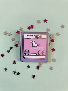 A 30mm hard enamel pin inspired by the game cartridge for the classic Nintendo DS game Nintendogs.  Your Nintendogs are always with you! Hardwearing, smooth, incredibly shiny polished silver finish with a black rubber clutch.  Please don't hesitate to get in touch with any questions. Enamel Pin Collection, Backpack Pins, Jacket Pins, Bag Pins, Pretty Pins, Game Cartridge, Patches And Pins, Enamel Lapel Pin, Pins And Patches