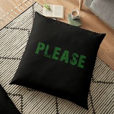 a black and green floor pillow with the words go vegan on it next to a cup of coffee