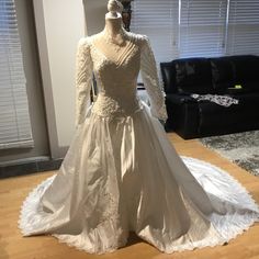 a wedding dress on display in a living room