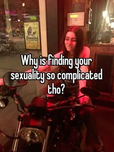 a woman sitting on top of a motorcycle with the caption why is finding your sexuality so complicated?