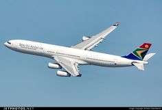 an airplane is flying in the air on a clear day with blue skies behind it