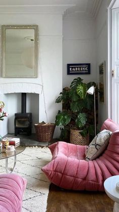 a living room filled with furniture and a fire place