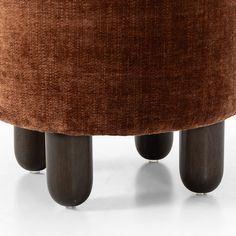 the foot stool is made from wood and fabric