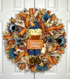 a wreath with an autumn and pumpkin theme