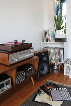 there is a record player and stereo in the room