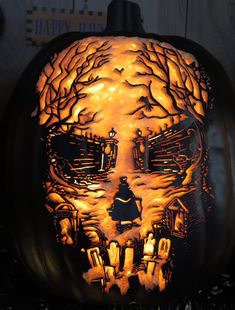 a carved pumpkin with an image of a skull on it