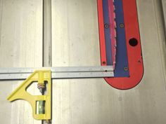 a pair of tools are sitting on the floor next to a measuring tape and ruler