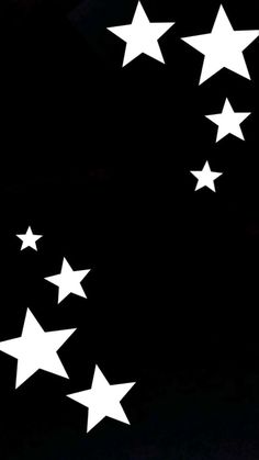 white stars are flying in the night sky