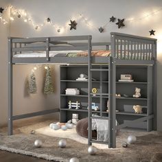 there is a bunk bed with a book shelf underneath it and christmas decorations on the wall