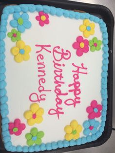 a birthday cake with flowers and the words happy birthday written on it