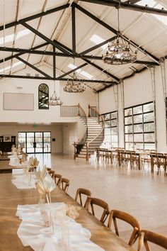 an empty banquet hall with tables and chairs