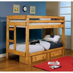 a bunk bed with drawers underneath it in a blue walled room next to a red rug