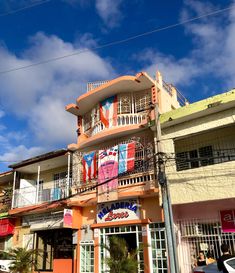 an orange and white building with balconies on it