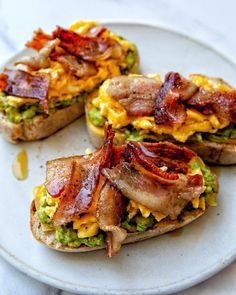 bacon and guacamole toasted sandwiches on a plate