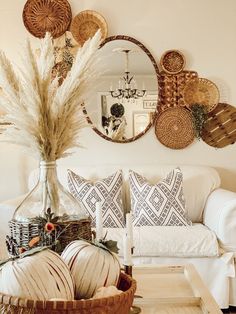 a living room filled with lots of furniture and decor on top of a wooden table