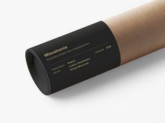 a roll of brown paper with black lettering on the front and back side that says mesquihne