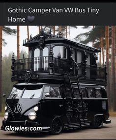 a black vw bus is parked in front of some trees and has the words gothic camper van vw bus tiny on it's side