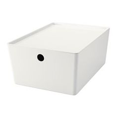 a white box with a black dot on the lid