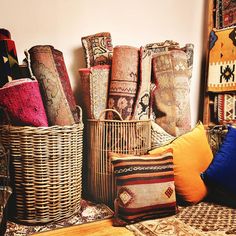 baskets and rugs are stacked on top of each other