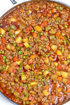 a pot filled with meat and vegetables on top of a stove