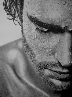 a black and white drawing of a man's face covered in water drops