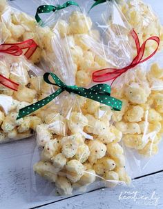 three bags filled with popcorn sitting on top of a table