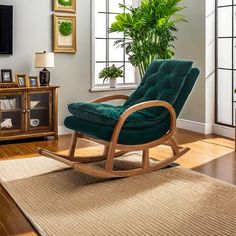 a living room with a rocking chair and potted plant