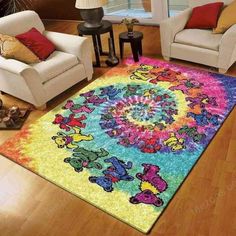 a living room with two chairs and a rug on the floor