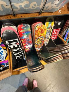 there are many skateboards on display in the store