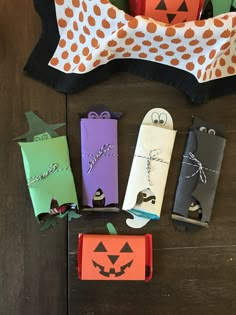 some paper bags with halloween decorations on them