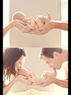 a man and woman holding a baby in their hands