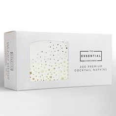 the essential cocktail napkins in white and gold foil stars are on top of each other